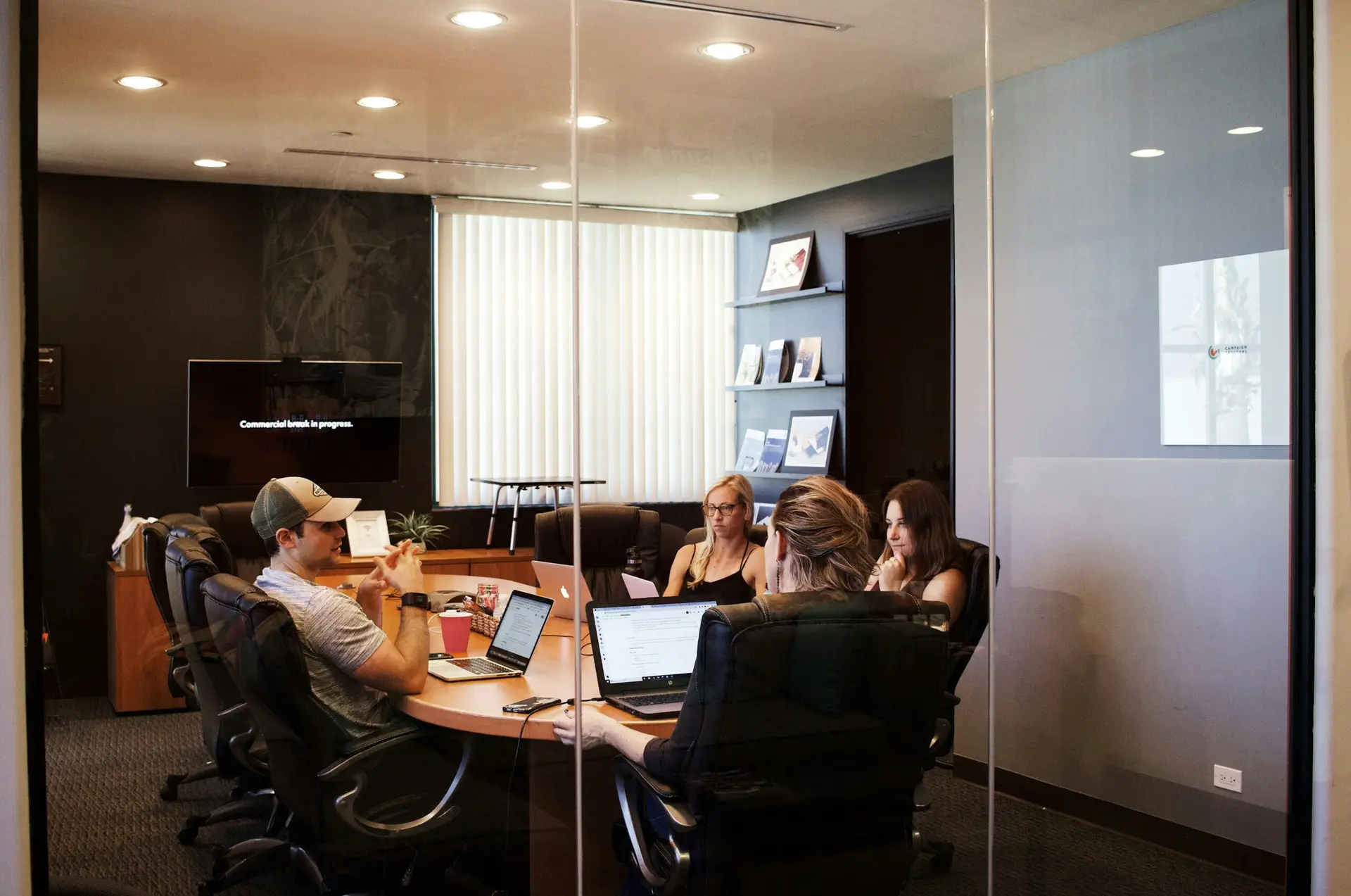 group of diverse professionals in a modern office setting, collaborating