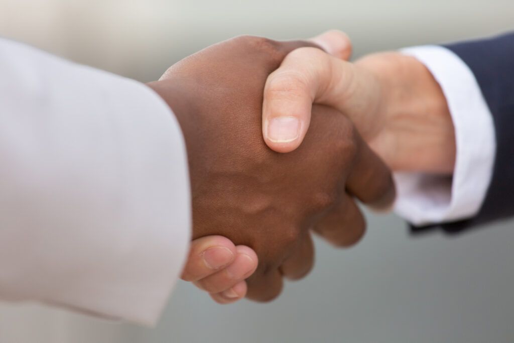 handshake between two professionals in a corporate setting